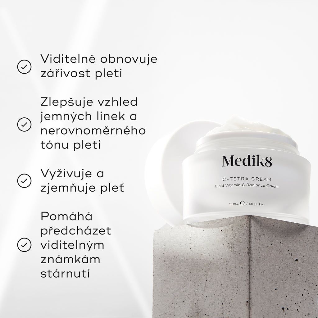 Dóza Medik8 C-Tetra Cream je zobrazena na šedém kamenném podstavci na bílém pozadí s jemnými světelnými paprsky.

Obrázek obsahuje čtyři tvrzení s odrážkami a fajfkami:

Viditelně obnovuje jas pleti
Zlepšuje vzhled jemných linek a nerovnoměrného tónu pleti
Vyživuje a zjemňuje pleť
Pomáhá předcházet viditelným známkám stárnutí